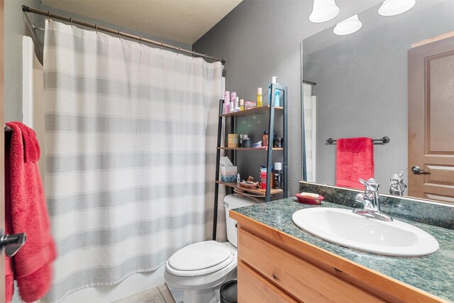 bathroom featuring vanity, toilet, and a shower with shower curtain