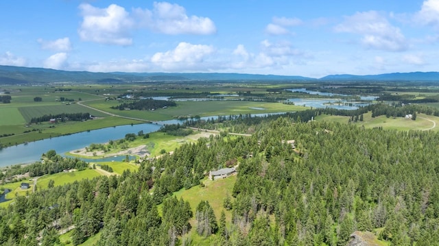 birds eye view of property featuring a rural view and a water and mountain view