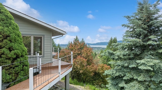 253 Pine Needle Ln, Bigfork, MT 59911 - wooden terrace with a mountain view