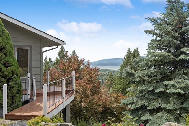 253 Pine Needle Ln, Bigfork, MT 59911 - view of yard with a deck with mountain view
