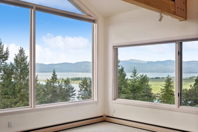 interior space featuring vaulted ceiling and a water and mountain view