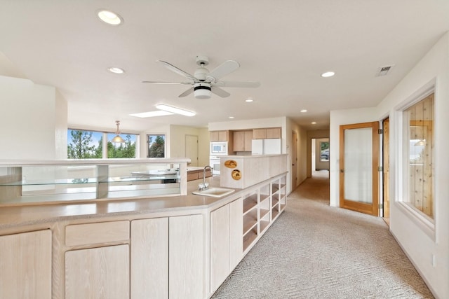 253 Pine Needle Ln, Bigfork, MT 59911 - kitchen featuring white appliances, light brown cabinetry, light colored carpet, a ceiling fan, and recessed lighting