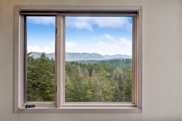 253 Pine Needle Ln, Bigfork, MT 59911 - mountain view with a heavily wooded area