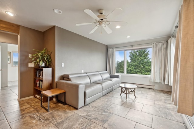 living room with ceiling fan and a baseboard heating unit