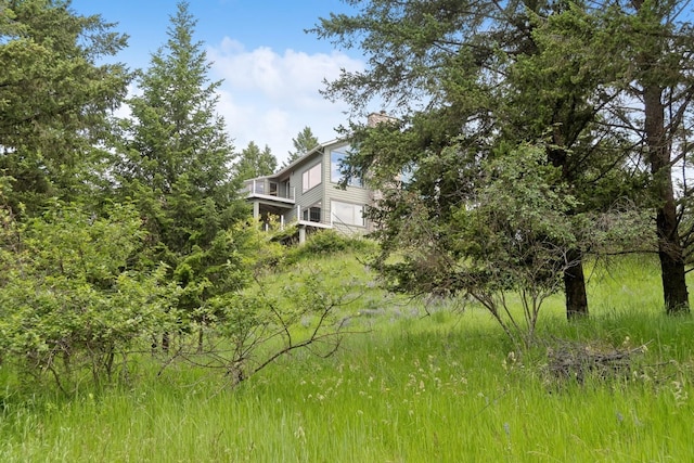 253 Pine Needle Ln, Bigfork, MT 59911 - view of yard featuring a balcony