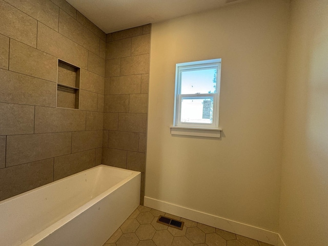 bathroom with tile patterned floors