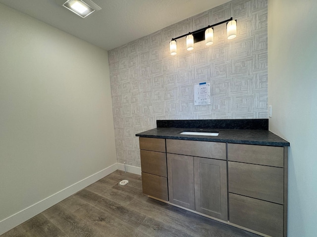 bathroom with wood-type flooring and sink