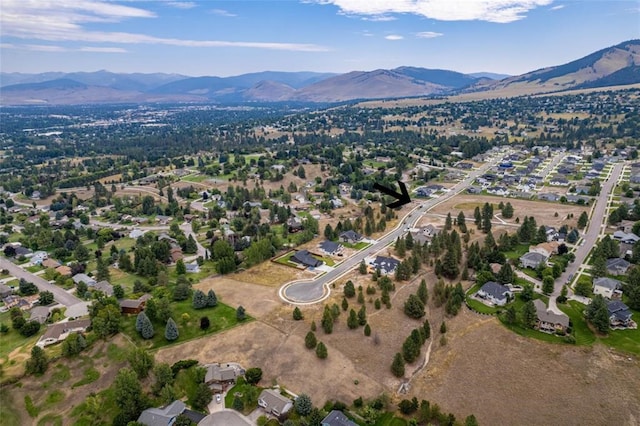 birds eye view of property featuring a mountain view