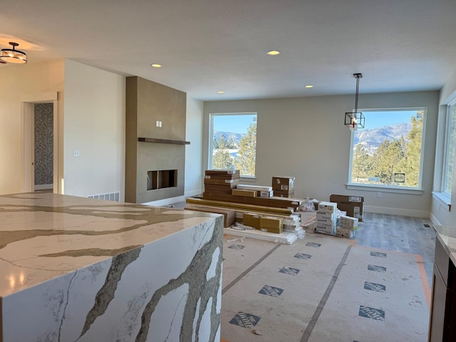 living room featuring plenty of natural light and light wood-type flooring