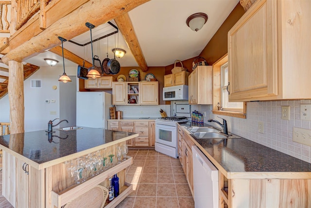 kitchen with an island with sink, sink, light brown cabinetry, and white appliances