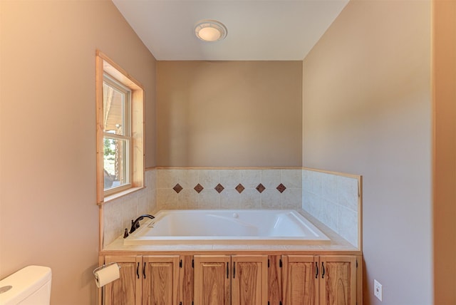 bathroom featuring a washtub and toilet