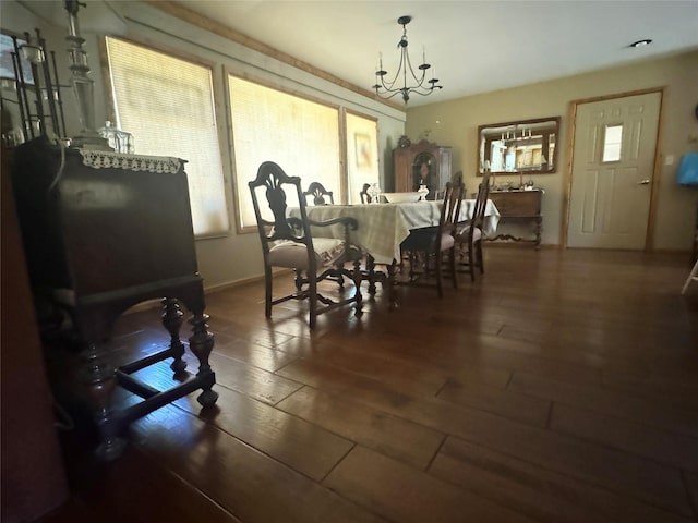 2378 Lake Creek Rd, Troy, MT 59935 - dining space featuring wood-type flooring and a chandelier
