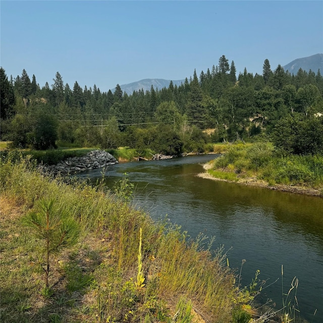 2378 Lake Creek Rd, Troy, MT 59935 - water view featuring a mountainous background and a forest
