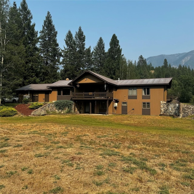 2378 Lake Creek Rd, Troy, MT 59935 - back of property with a yard and a deck with mountain view
