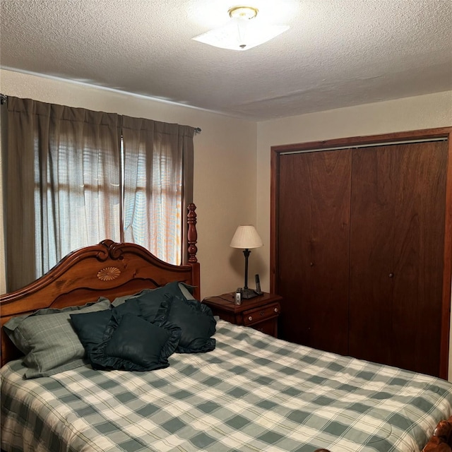 2378 Lake Creek Rd, Troy, MT 59935 - bedroom featuring a textured ceiling, a closet, and carpet floors