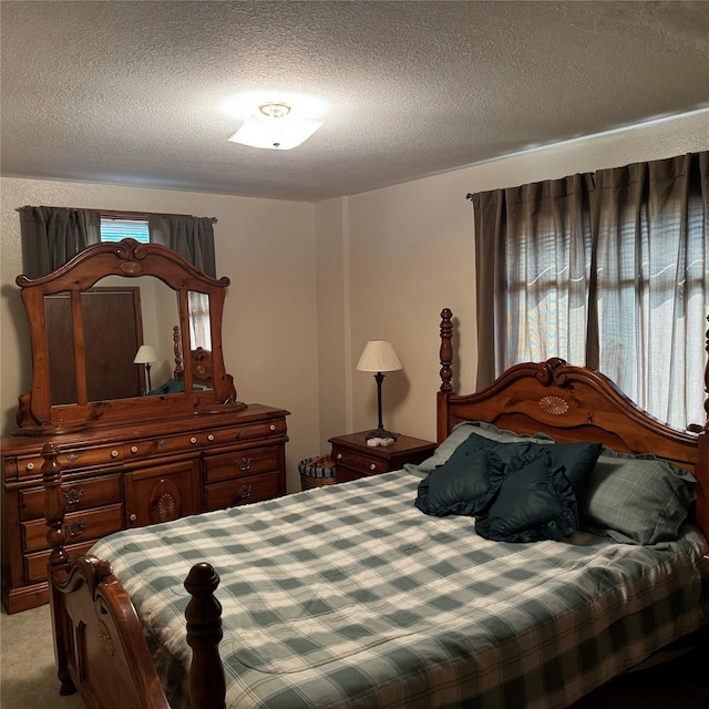 2378 Lake Creek Rd, Troy, MT 59935 - bedroom with a textured ceiling, multiple windows, and light carpet