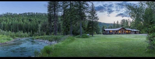 2378 Lake Creek Rd, Troy, MT 59935 - view of green lawn with a wooded view