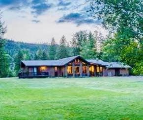 2378 Lake Creek Rd, Troy, MT 59935 - rear view of house with a yard