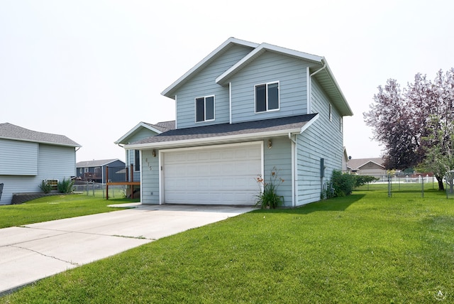 view of front of property with a garage and a front lawn