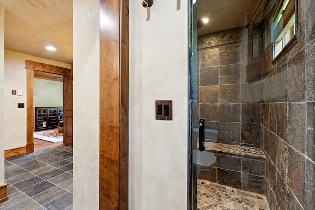 bathroom featuring a stall shower and recessed lighting