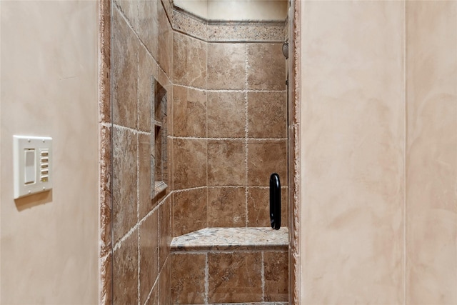 interior details featuring a shower stall