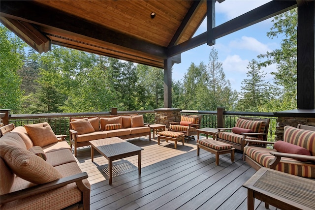 wooden terrace with an outdoor hangout area