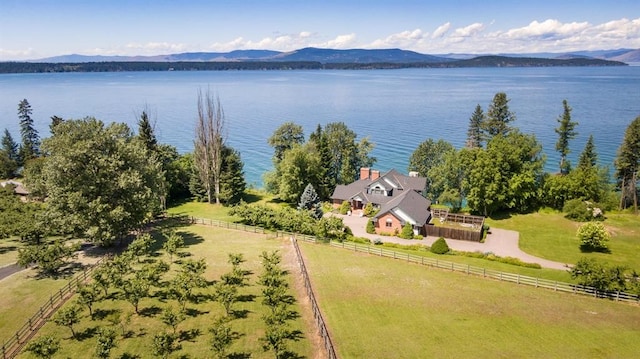 bird's eye view with a water and mountain view