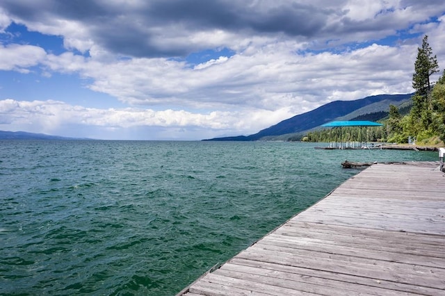 dock area with a water and mountain view