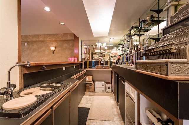 bar with sink and light tile patterned floors