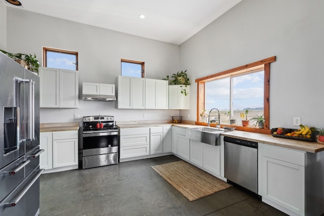 kitchen with white cabinetry, sink, and stainless steel appliances