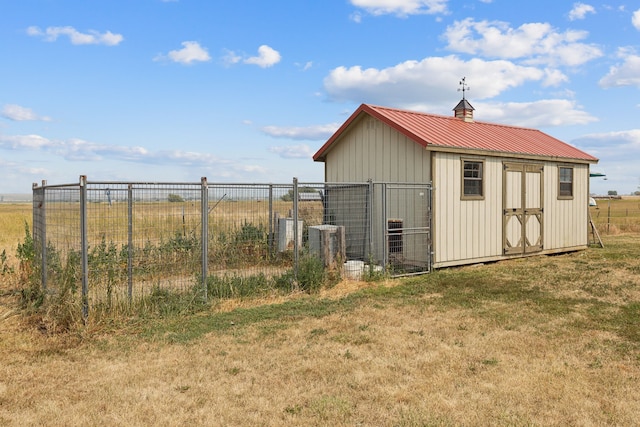 view of outbuilding with a lawn