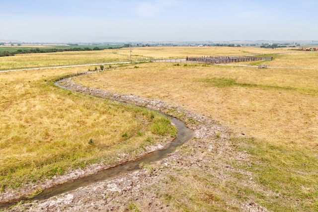 birds eye view of property featuring a rural view