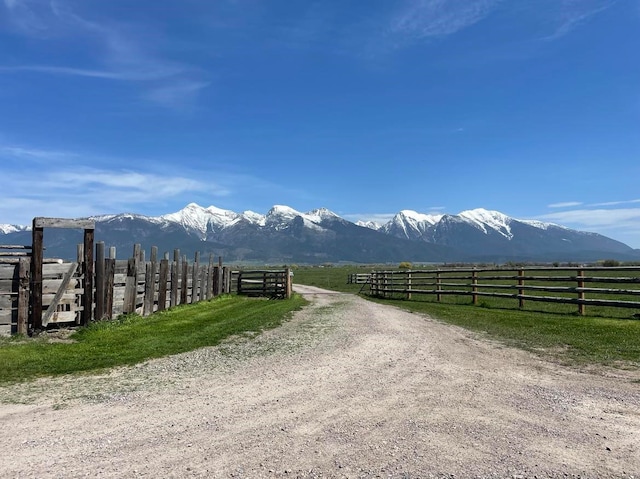 view of street with a mountain view and a rural view