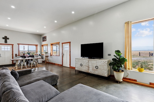 living room with a towering ceiling