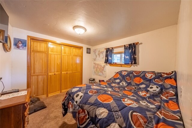 carpeted bedroom featuring a closet