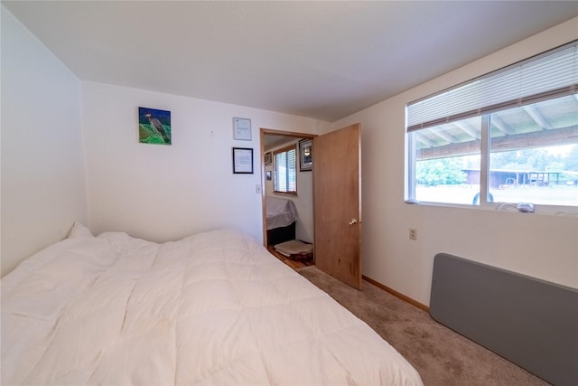 carpeted bedroom with baseboards