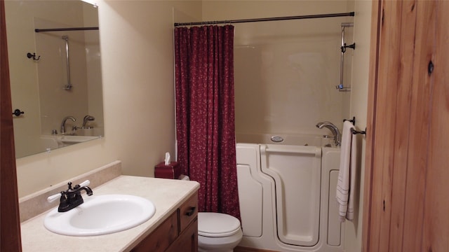 full bathroom with vanity, toilet, and shower / bath combination with curtain