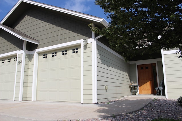 garage featuring wooden walls