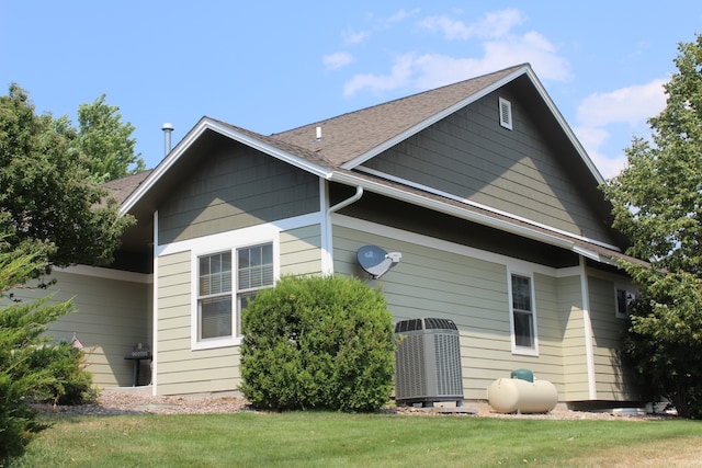 view of property exterior with a lawn