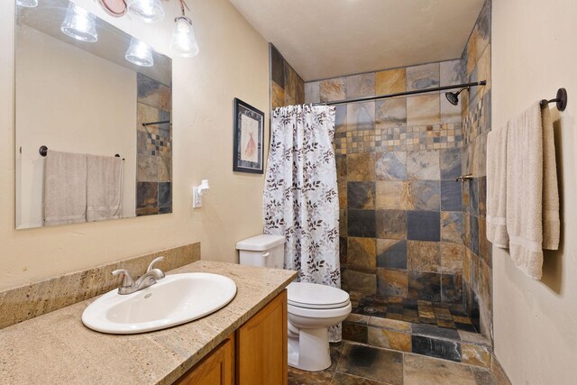 881 Lone Coyote Trl, Kalispell, MT 59901 - full bath with vanity, a tile shower, and stone finish flooring