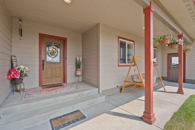 881 Lone Coyote Trl, Kalispell, MT 59901 - property entrance featuring a porch