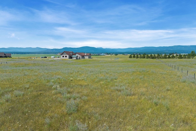 881 Lone Coyote Trl, Kalispell, MT 59901 - property view of mountains featuring a rural view