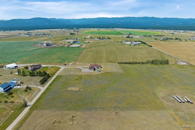 881 Lone Coyote Trl, Kalispell, MT 59901 - view of property location with rural landscape and a mountain backdrop