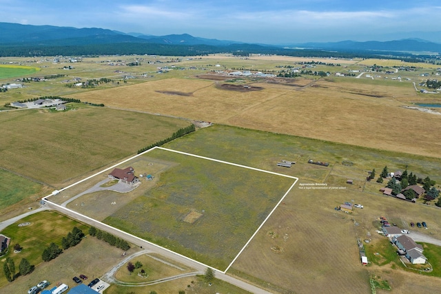 881 Lone Coyote Trl, Kalispell, MT 59901 - view of rural area with mountains and property boundaries highlighted