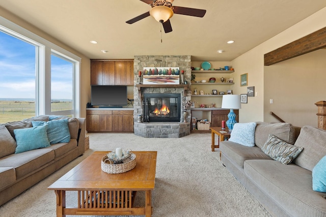 881 Lone Coyote Trl, Kalispell, MT 59901 - living area featuring light colored carpet, ceiling fan, a fireplace, and recessed lighting
