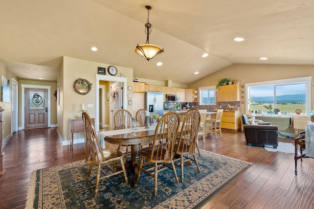 881 Lone Coyote Trl, Kalispell, MT 59901 - dining area with lofted ceiling, dark wood finished floors, and recessed lighting