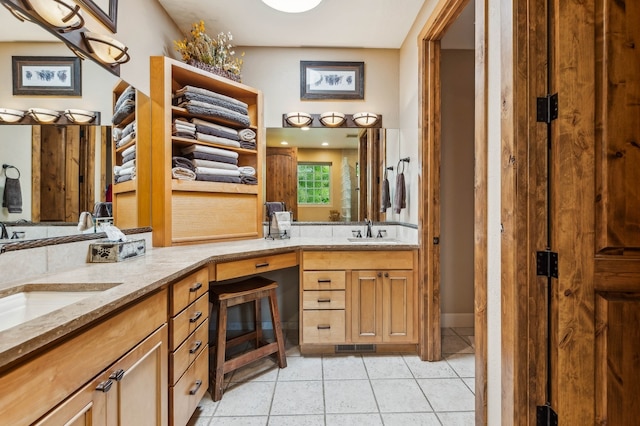 bathroom featuring dual vanity and tile patterned floors