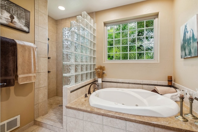 bathroom with shower with separate bathtub