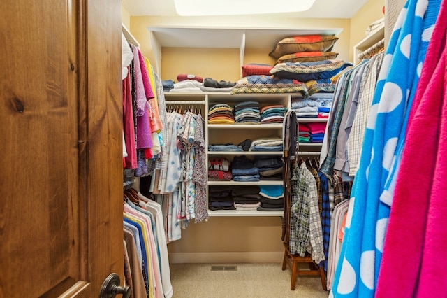 walk in closet featuring carpet