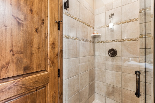 bathroom with a tile shower